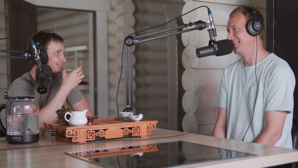 black and silver microphone on brown wooden table