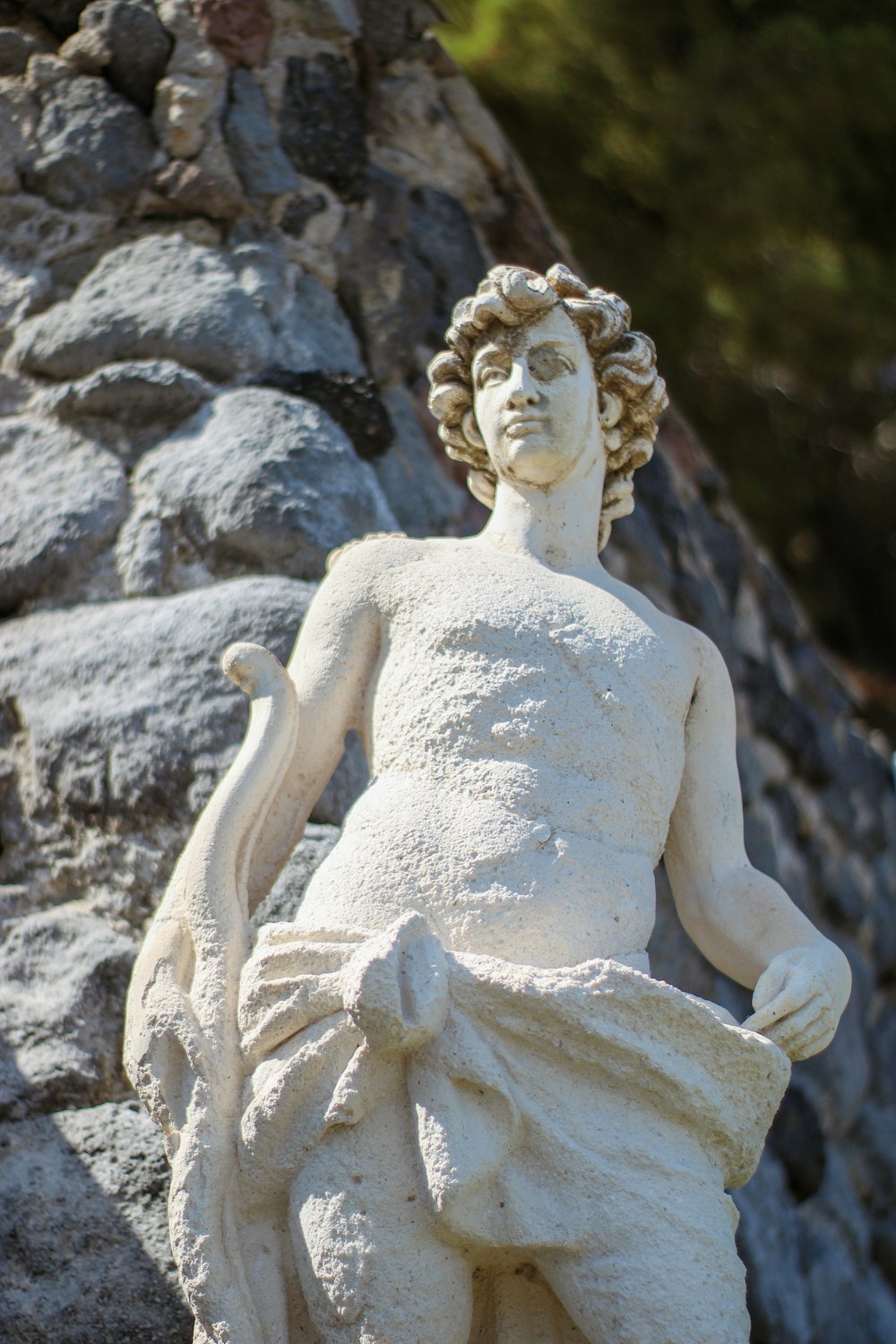 angel statue on gray rock