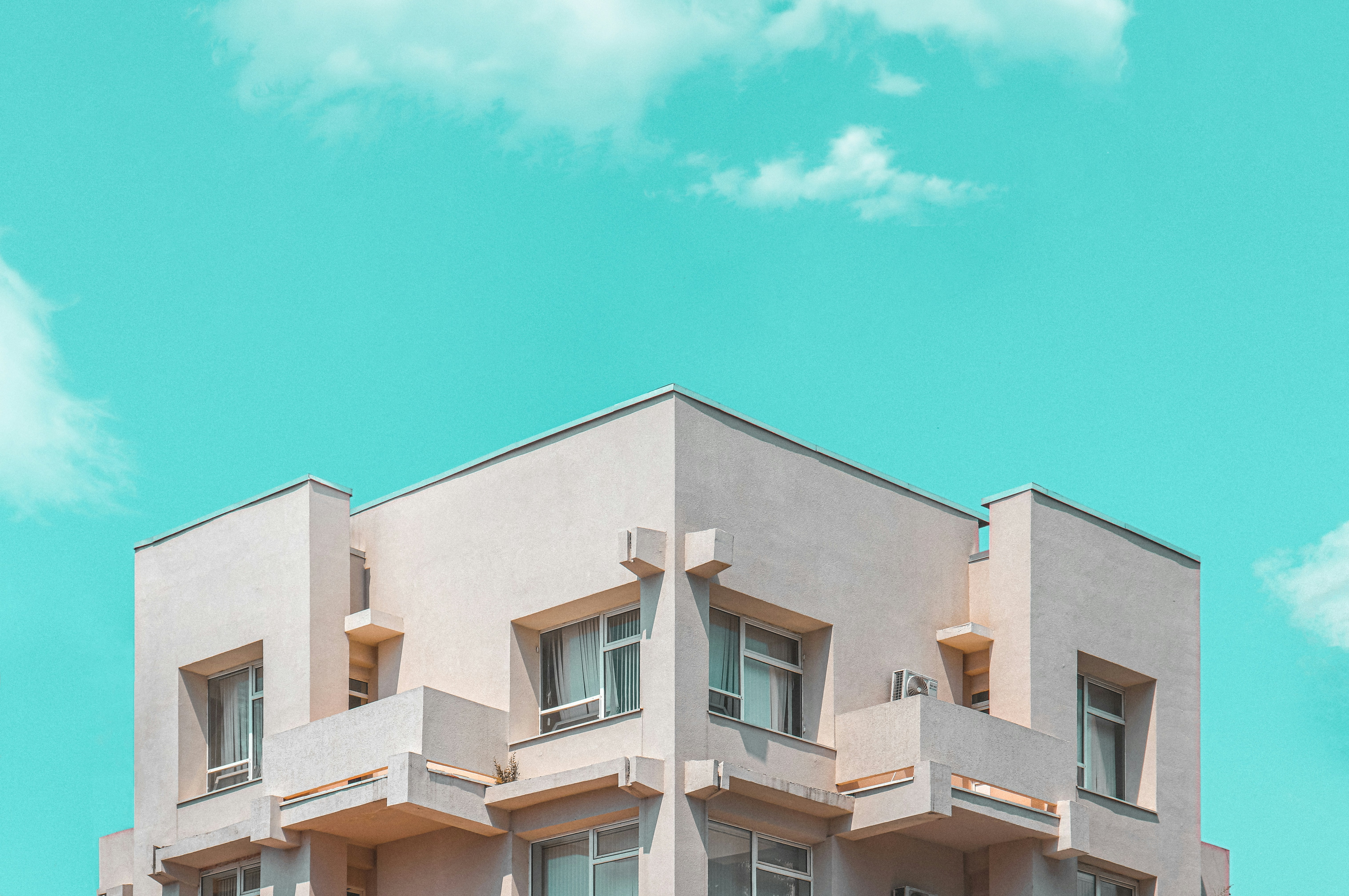 beige concrete building under blue sky during daytime