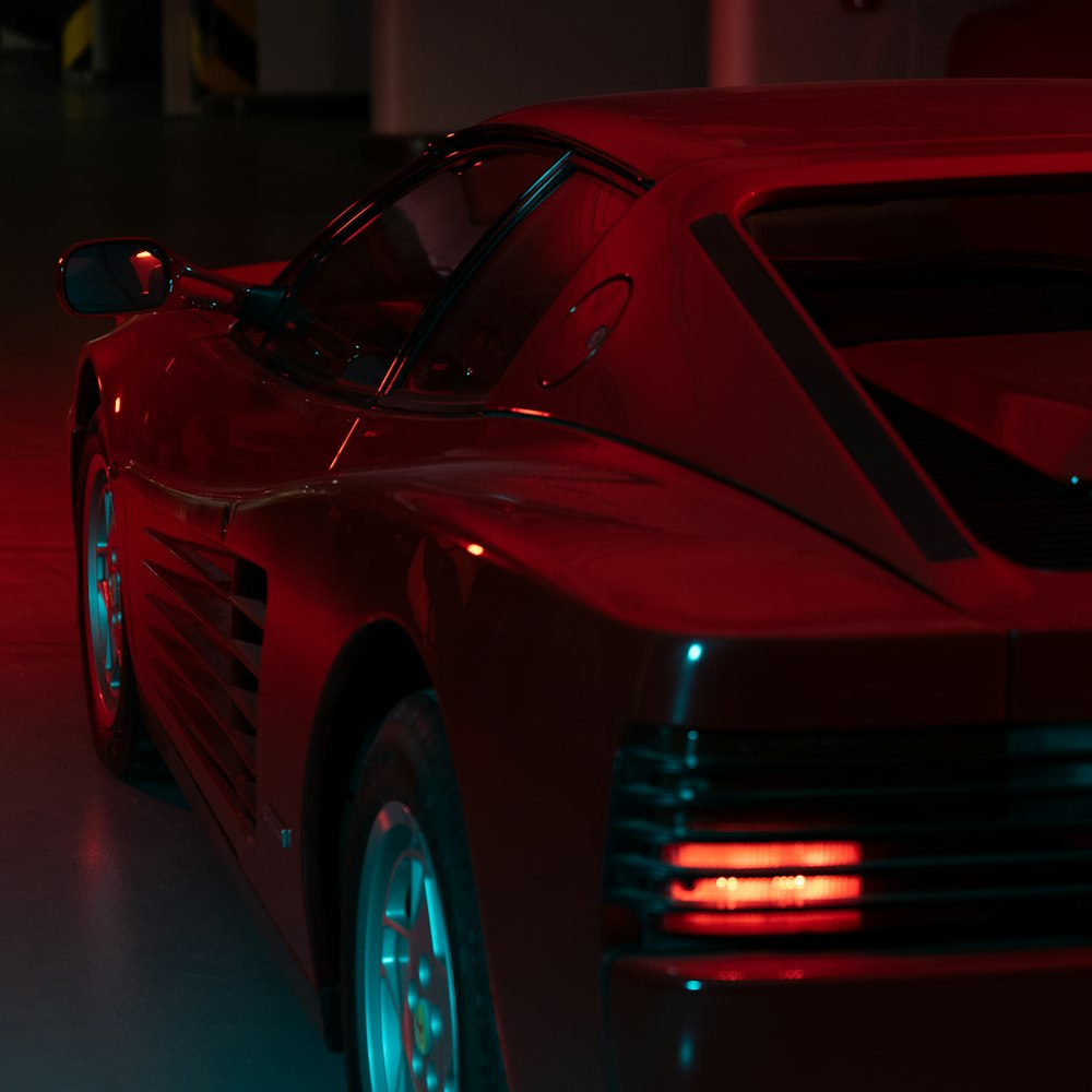 red porsche 911 parked in a room