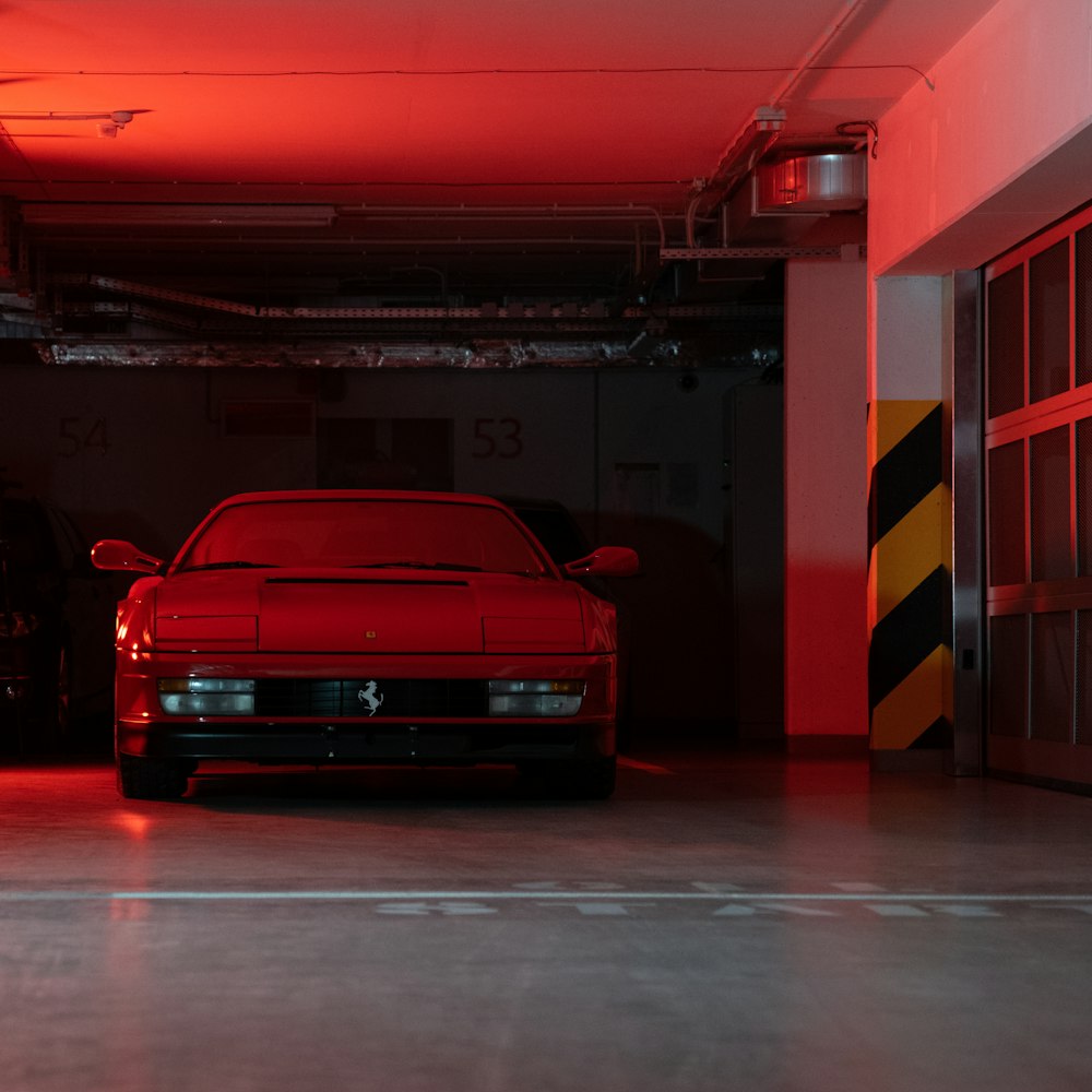 red chevrolet car in a garage