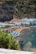 A vibrant beach scene showing colorful beach umbrellas shading happy families.