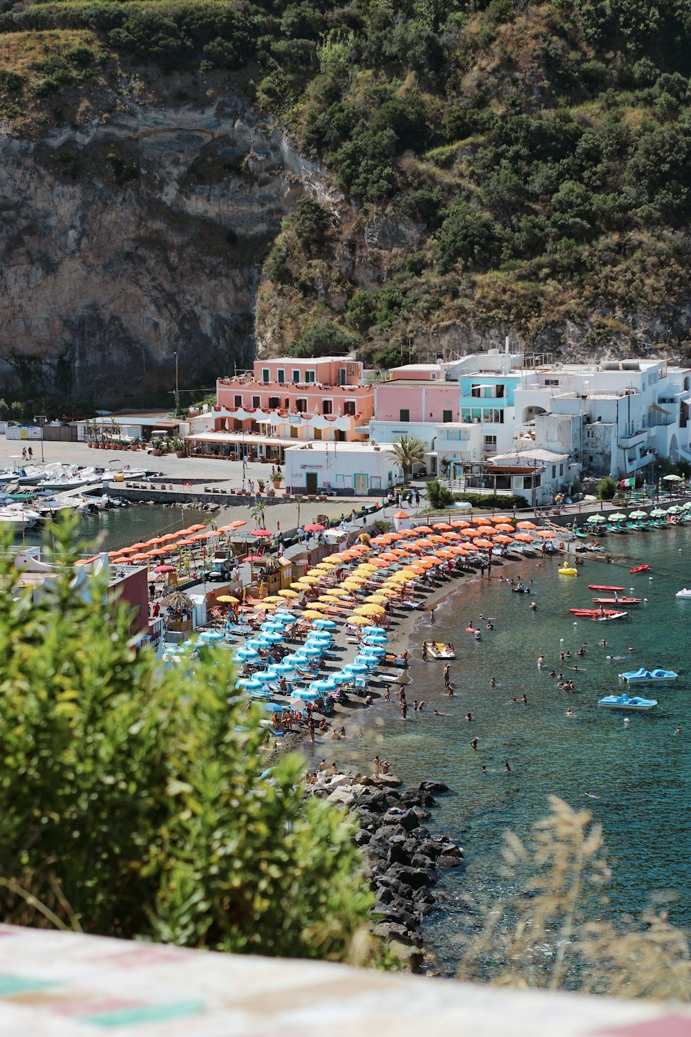 aerial view of boats on sea near city buildings during daytime