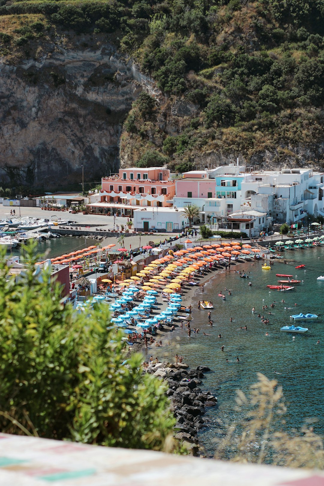 aerial view of boats on sea near city buildings during daytime