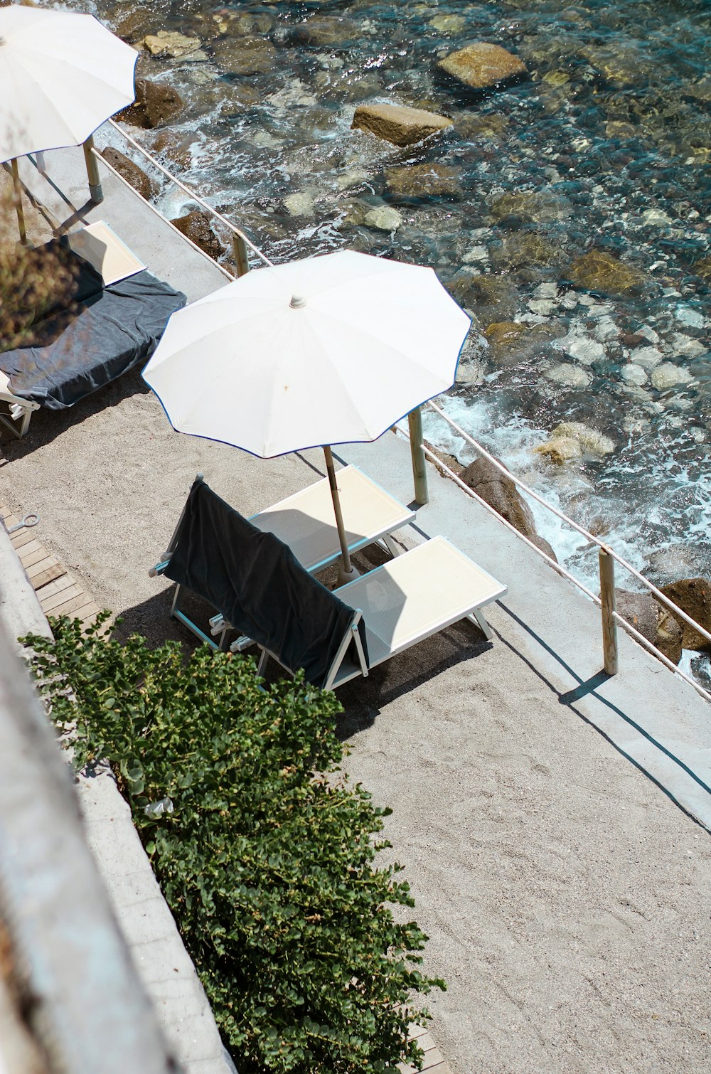 white umbrella on gray concrete floor