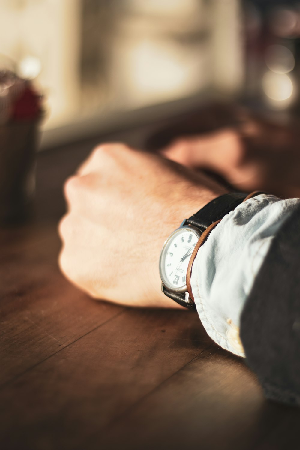 person wearing white analog watch