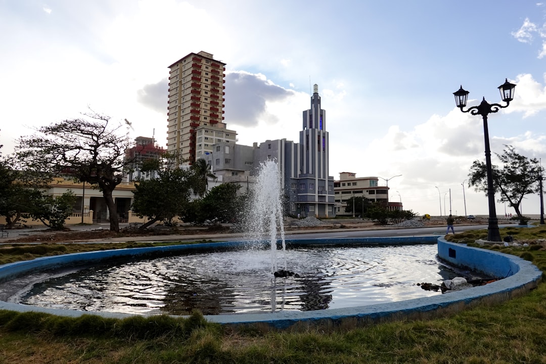 water fountain near high rise buildings during daytime