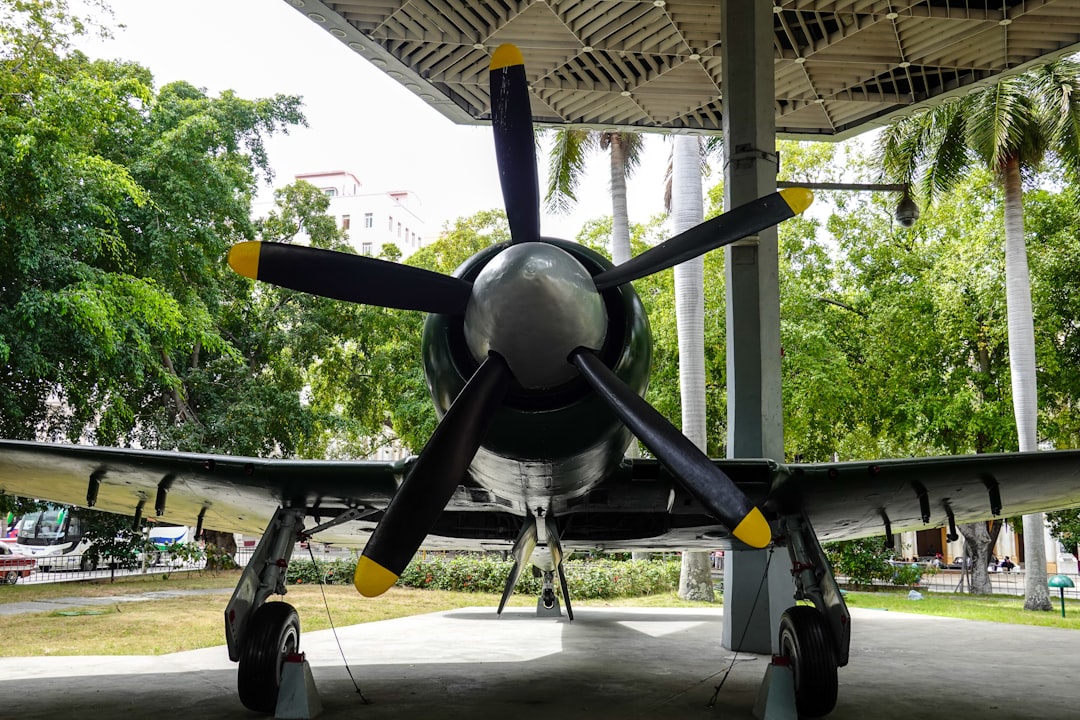 black and yellow plane on gray concrete ground during daytime