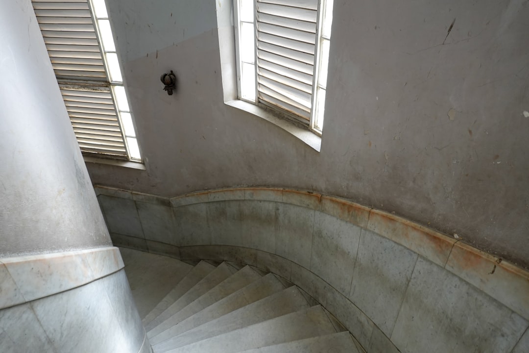 white and gray concrete spiral staircase