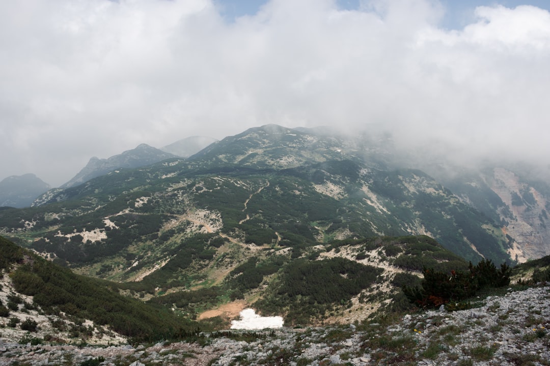 green mountains under white clouds during daytime