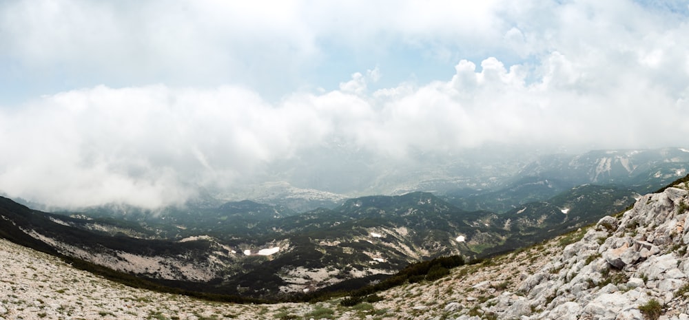 black and white mountains under white clouds during daytime