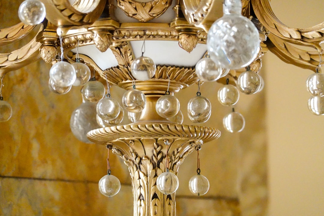 clear glass chandelier turned on in close up photography