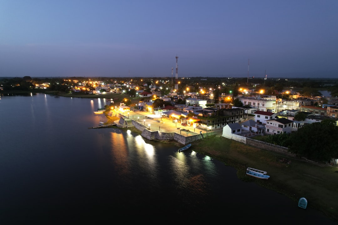 white and yellow boats on water during night time