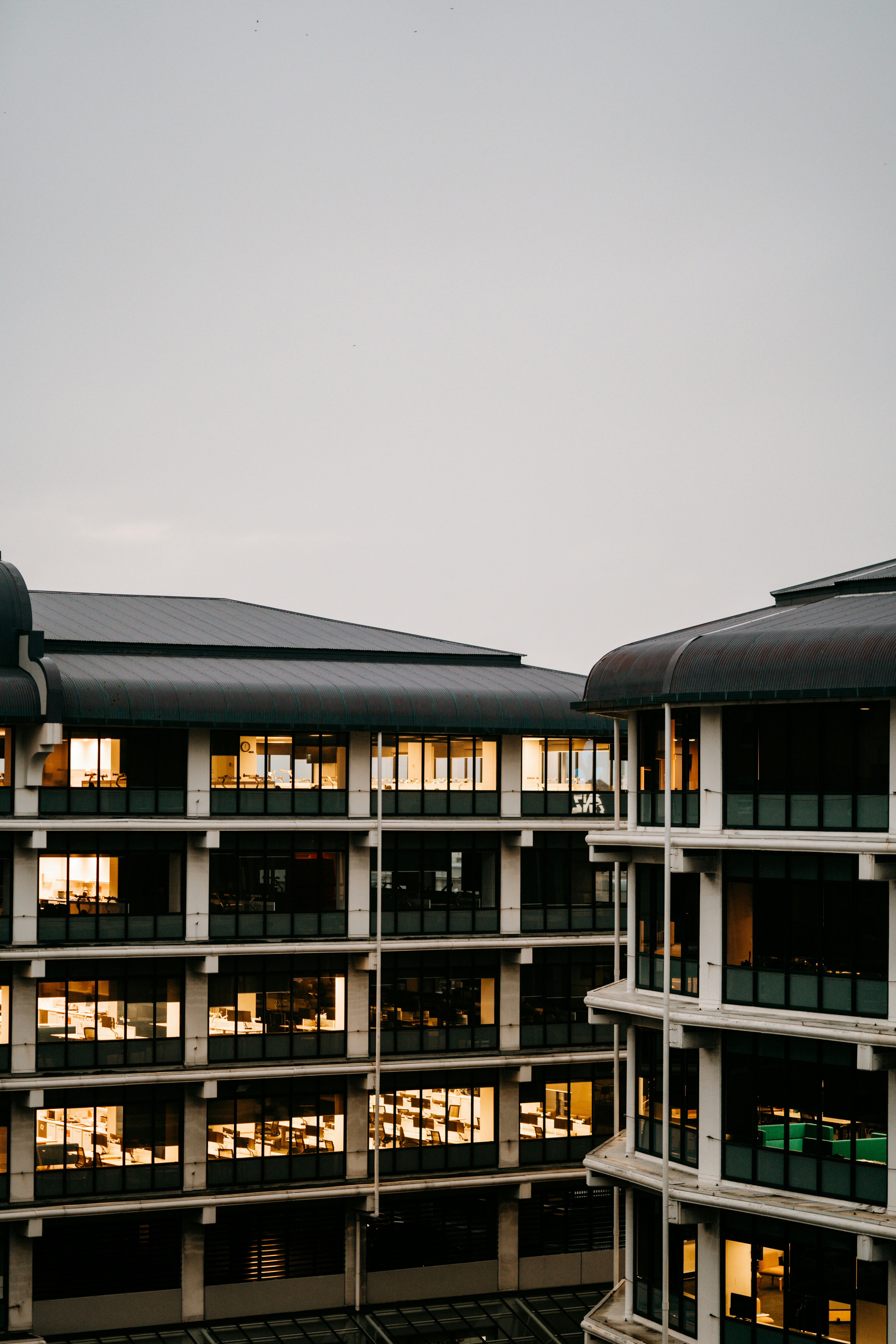 black and white concrete building under white sky during daytime