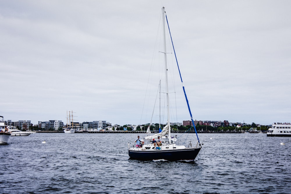 white boat on sea during daytime