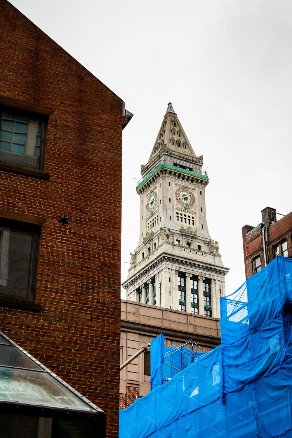 brown concrete building with clock tower