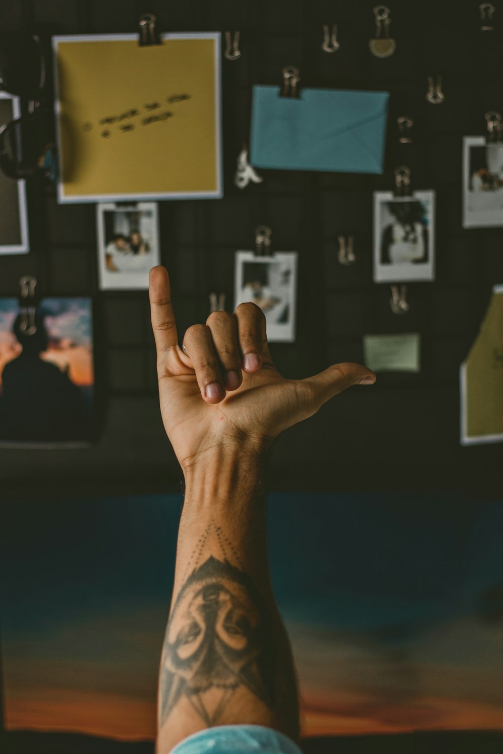 person showing right hand doing peace sign