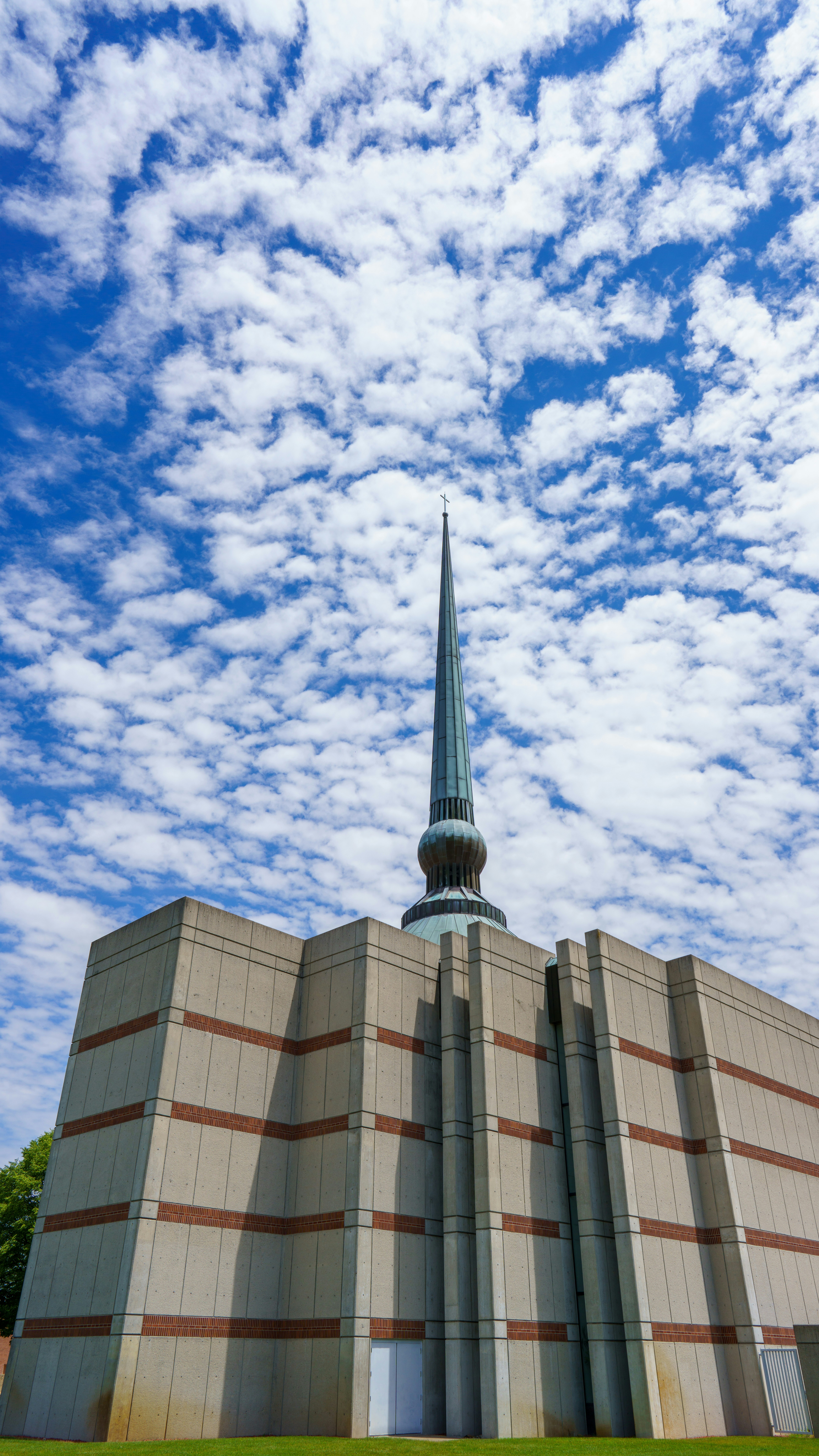 brown concrete building under white clouds during daytime
