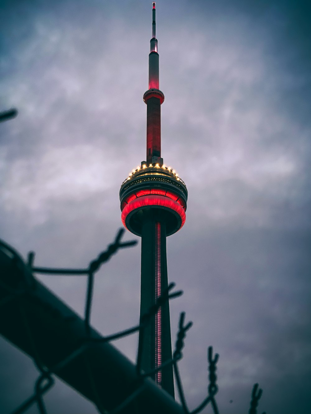 red and gold tower under cloudy sky