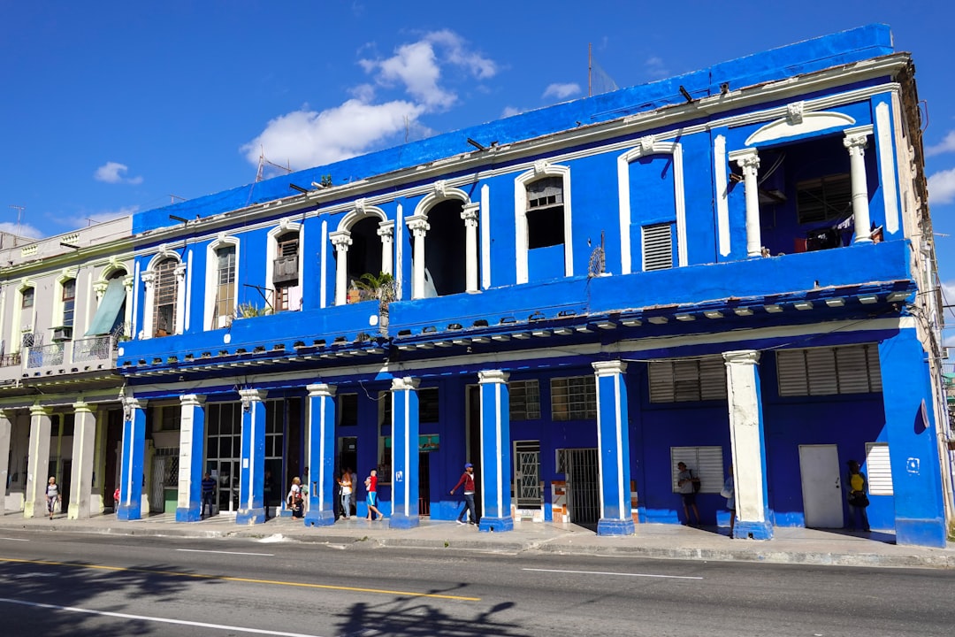 brown and white concrete building under blue sky during daytime