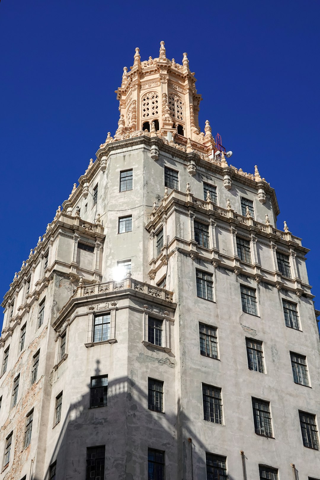 beige concrete building under blue sky during daytime