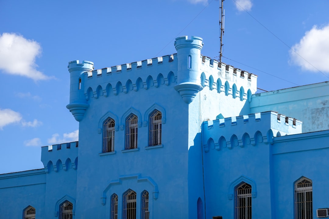 white concrete building under blue sky during daytime