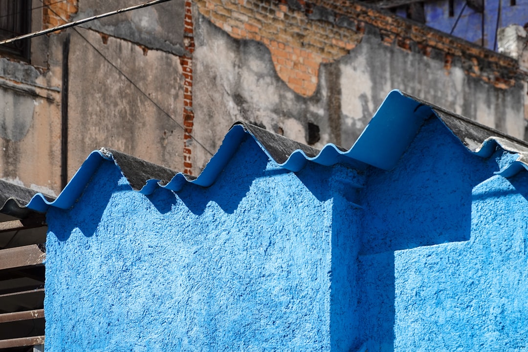 blue concrete wall with brown rope