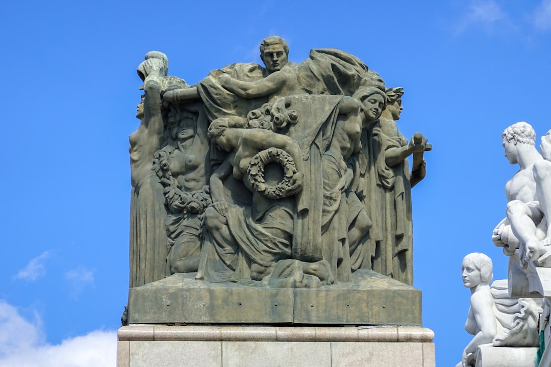 grey concrete statue under blue sky during daytime