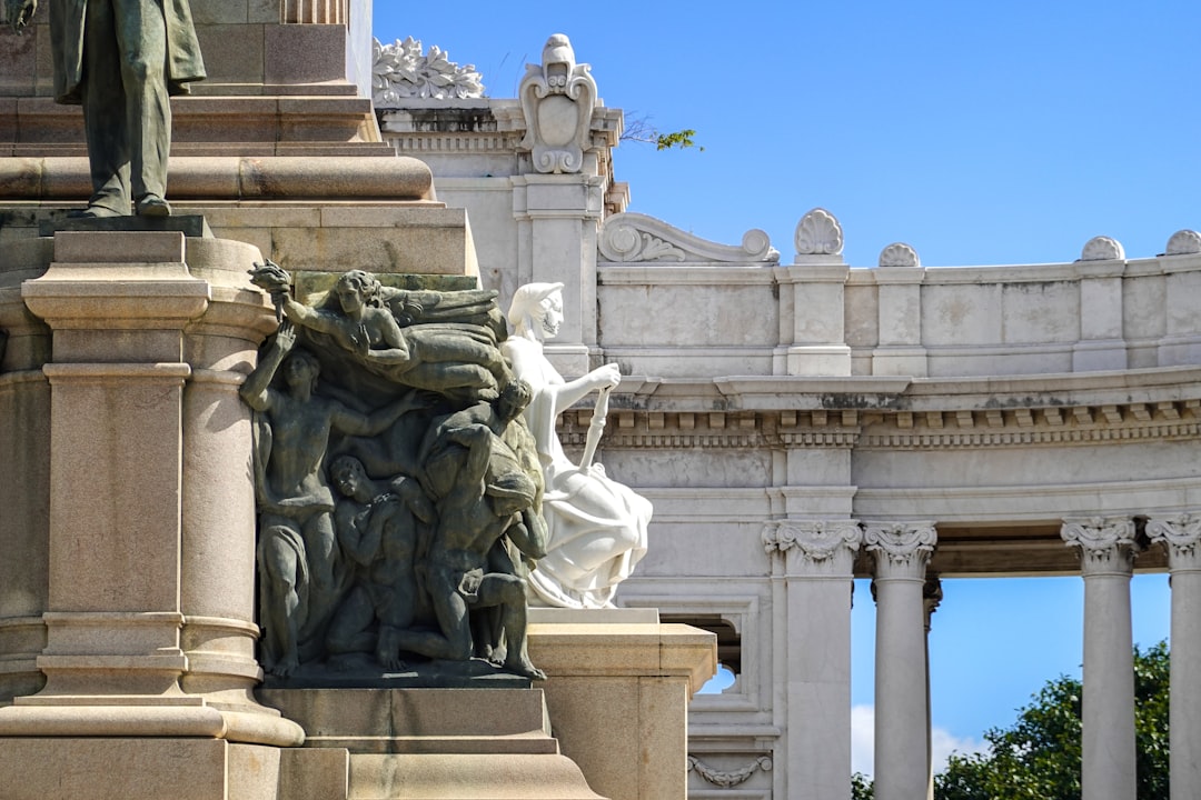 white concrete statue of man riding horse