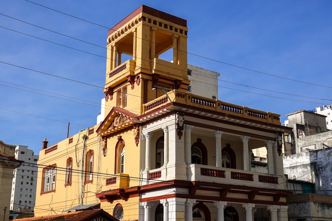 yellow and white concrete building under blue sky during daytime