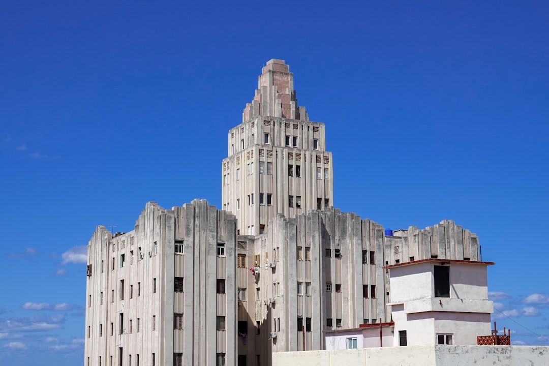 white concrete building under blue sky during daytime