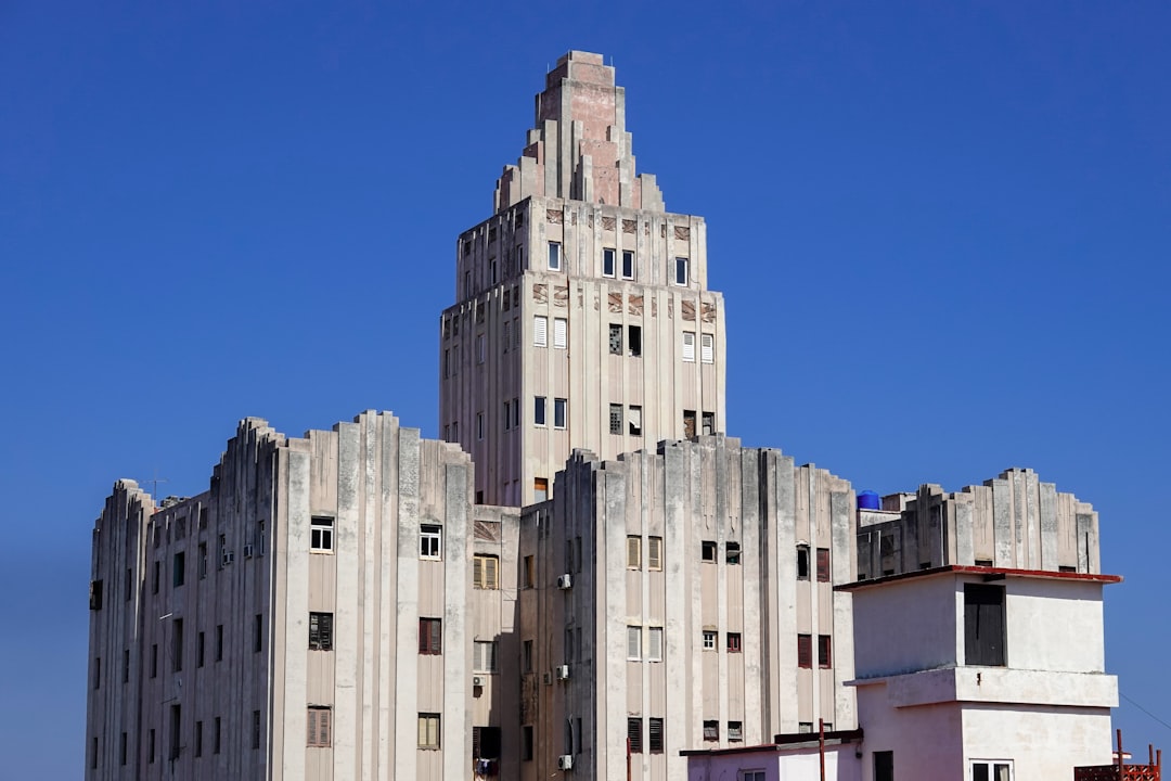 white concrete building under blue sky during daytime