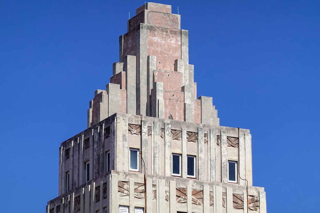 beige concrete building under blue sky during daytime