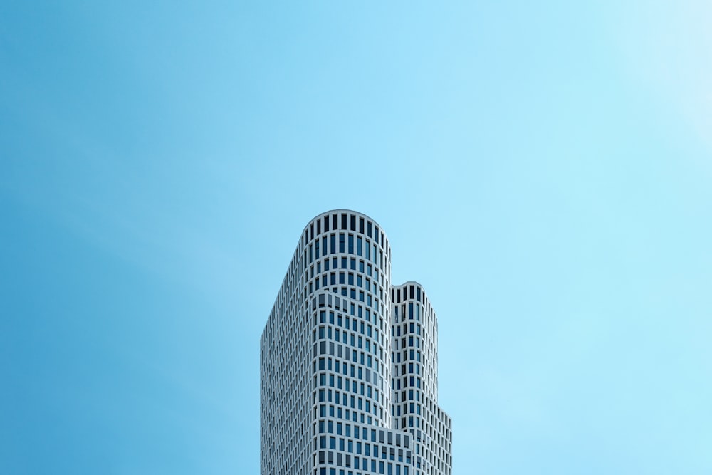 white and black concrete building under blue sky during daytime