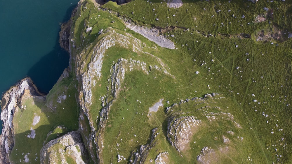 green grass covered mountain during daytime