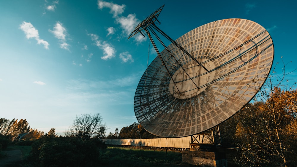 gray satellite dish under blue sky during daytime