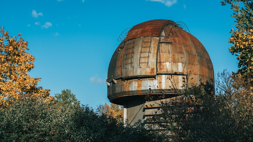 brown wooden dome building under blue sky during daytime
