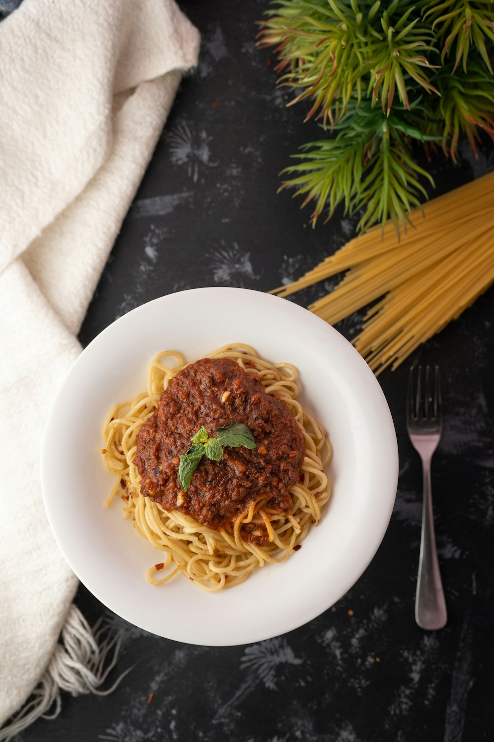 spaghetti on white ceramic plate