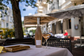 clear wine glass on white table