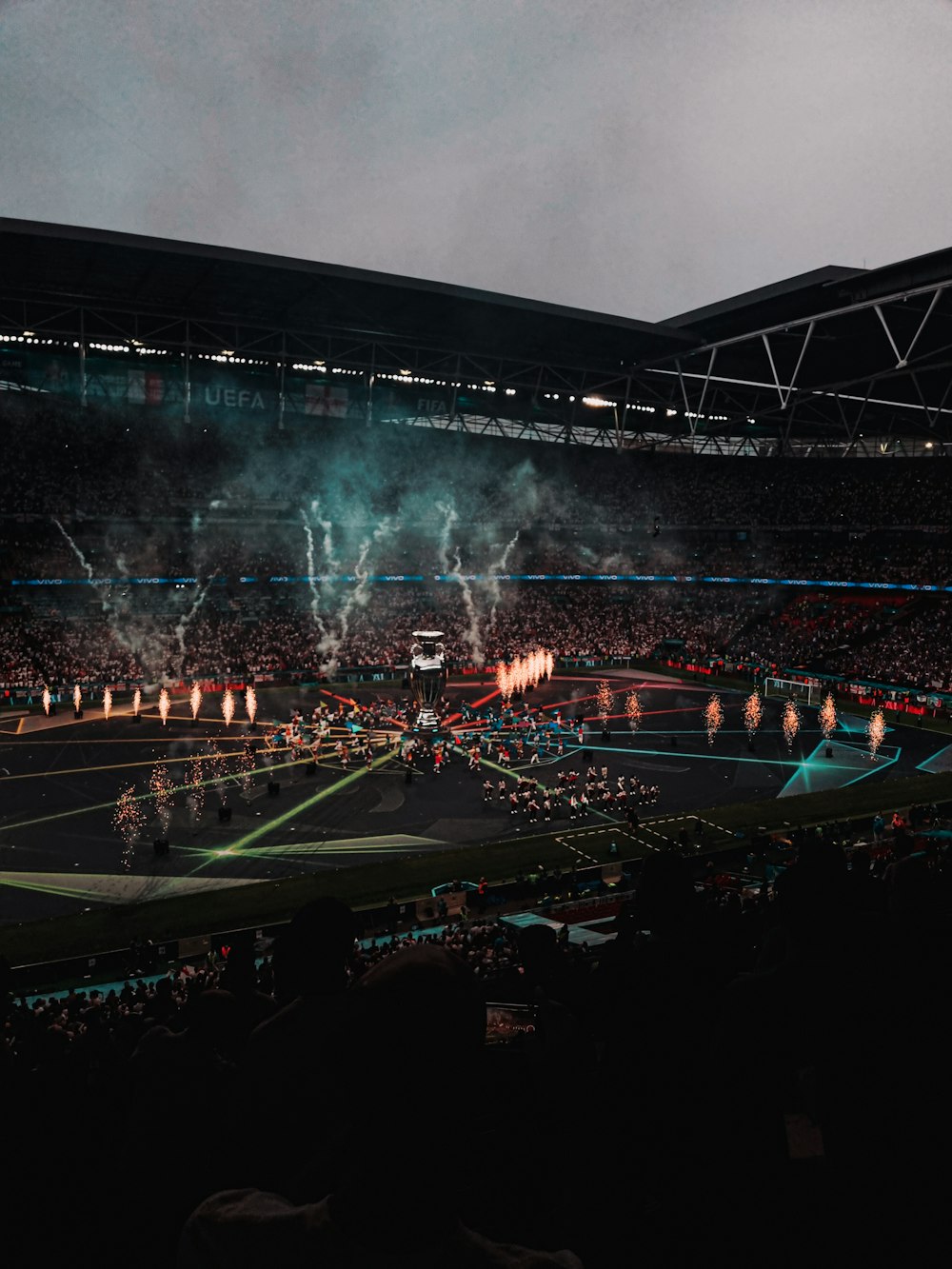 people watching game on stadium during nighttime