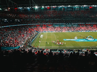 people watching football game on stadium