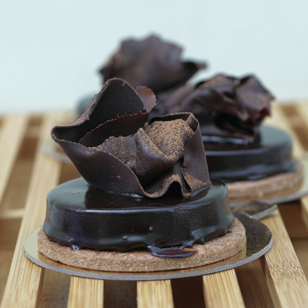 chocolate cake on brown wooden round tray