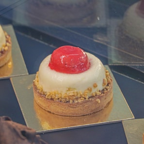A delicate French dessert plated elegantly, highlighting pastry skills learned in Denmark.