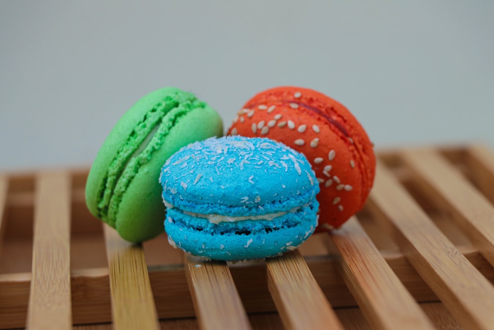 green and red cookies on brown wooden table