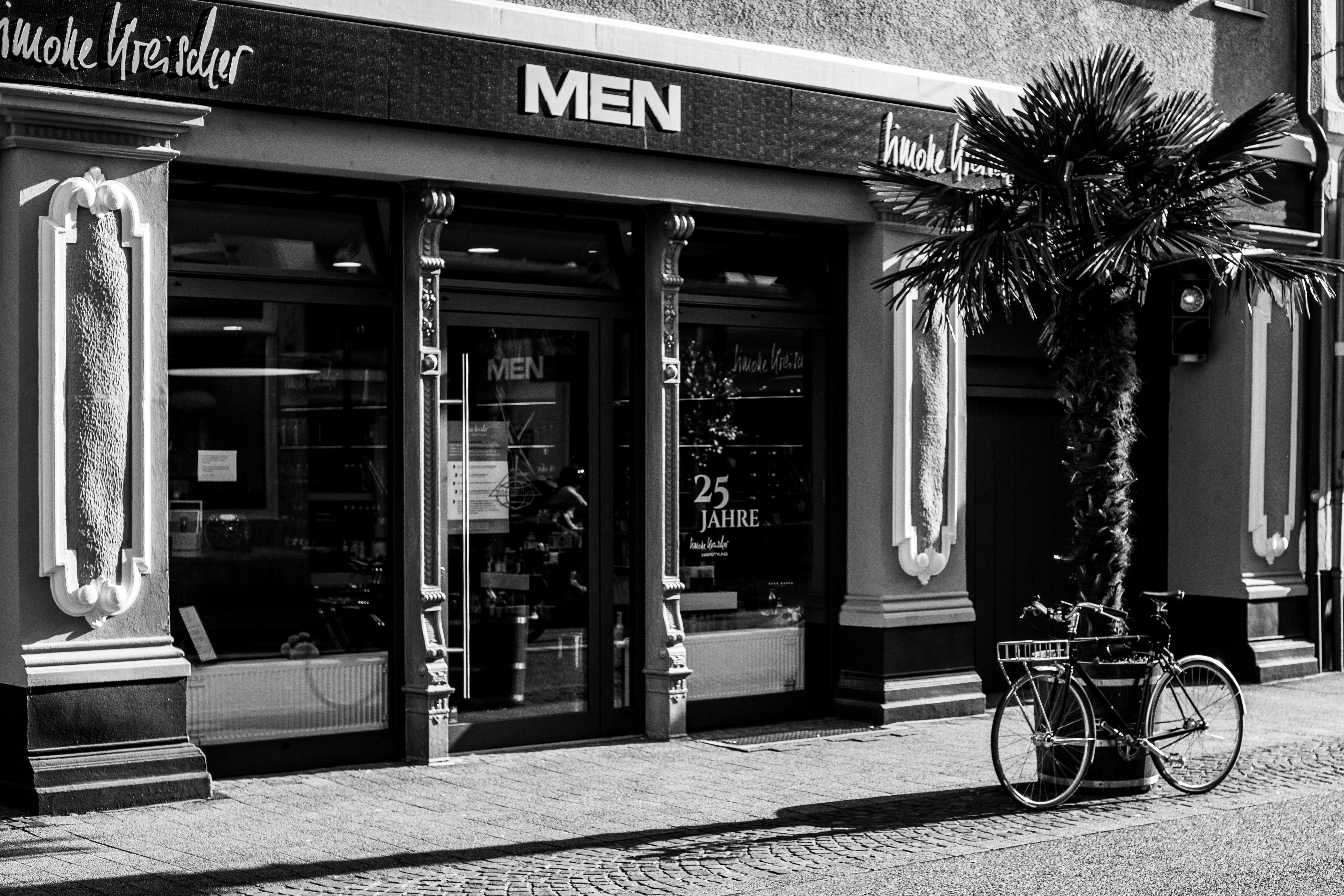 grayscale photo of a store front