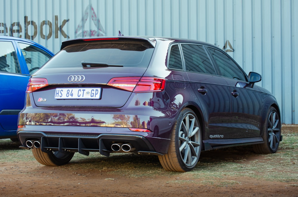 blue honda sedan on brown soil