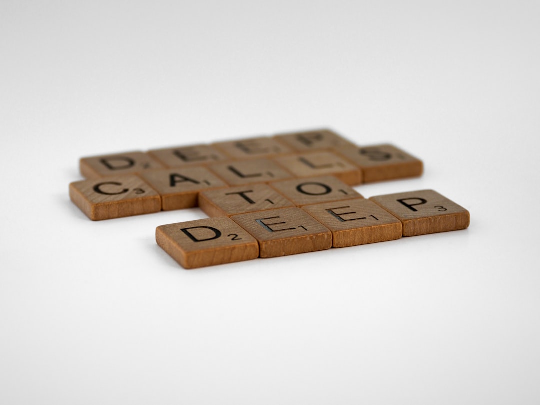 brown wooden letter r on white surface