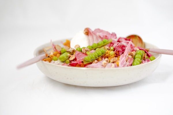 Sliced vegetable in white ceramic bowl