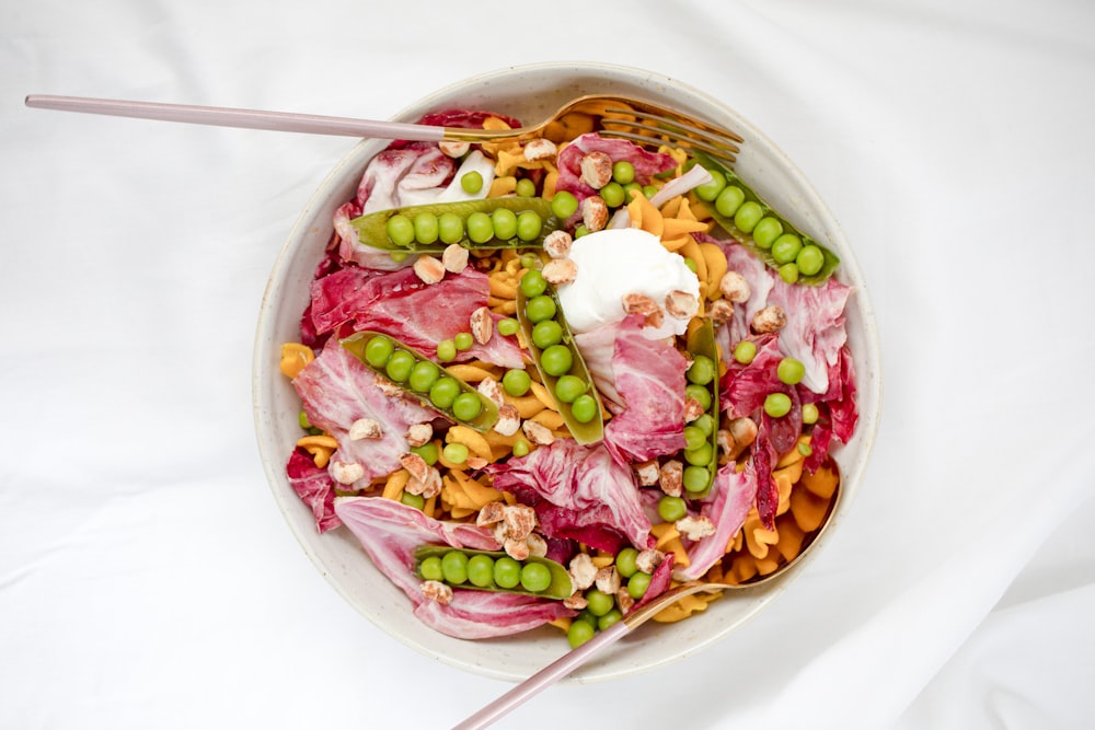 pink and white candies in bowl