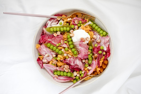 Pink and white candies in bowl